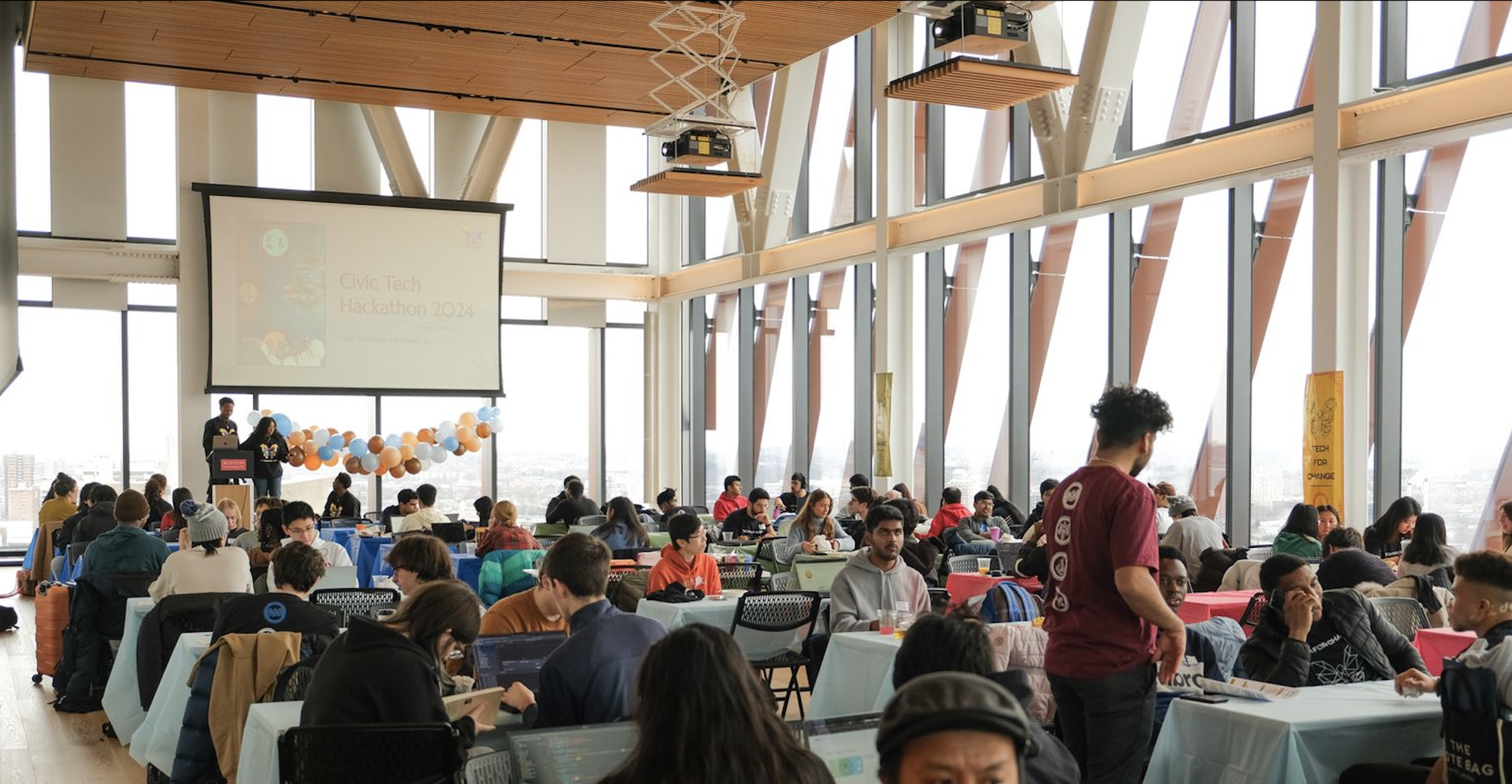 Many dozen students during 2024's hackathon on the 17th floor of the Center for Computing & Data Sciences building.